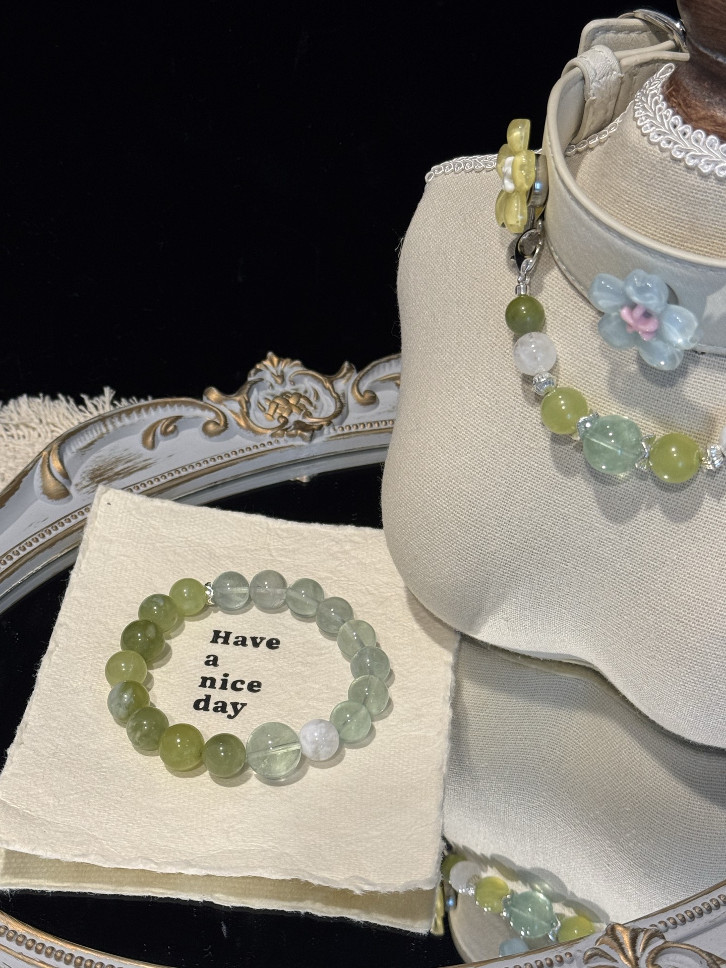 Fern crystal bracelet beside the coordinated collar bead strand