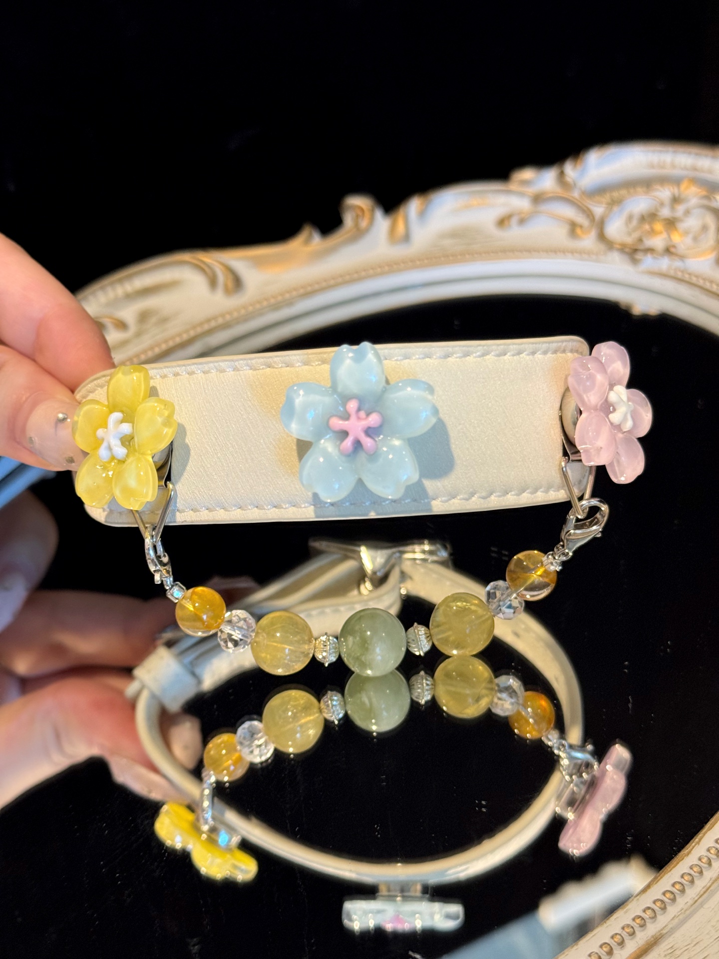 A coordinated pet collar and adult bracelet held together